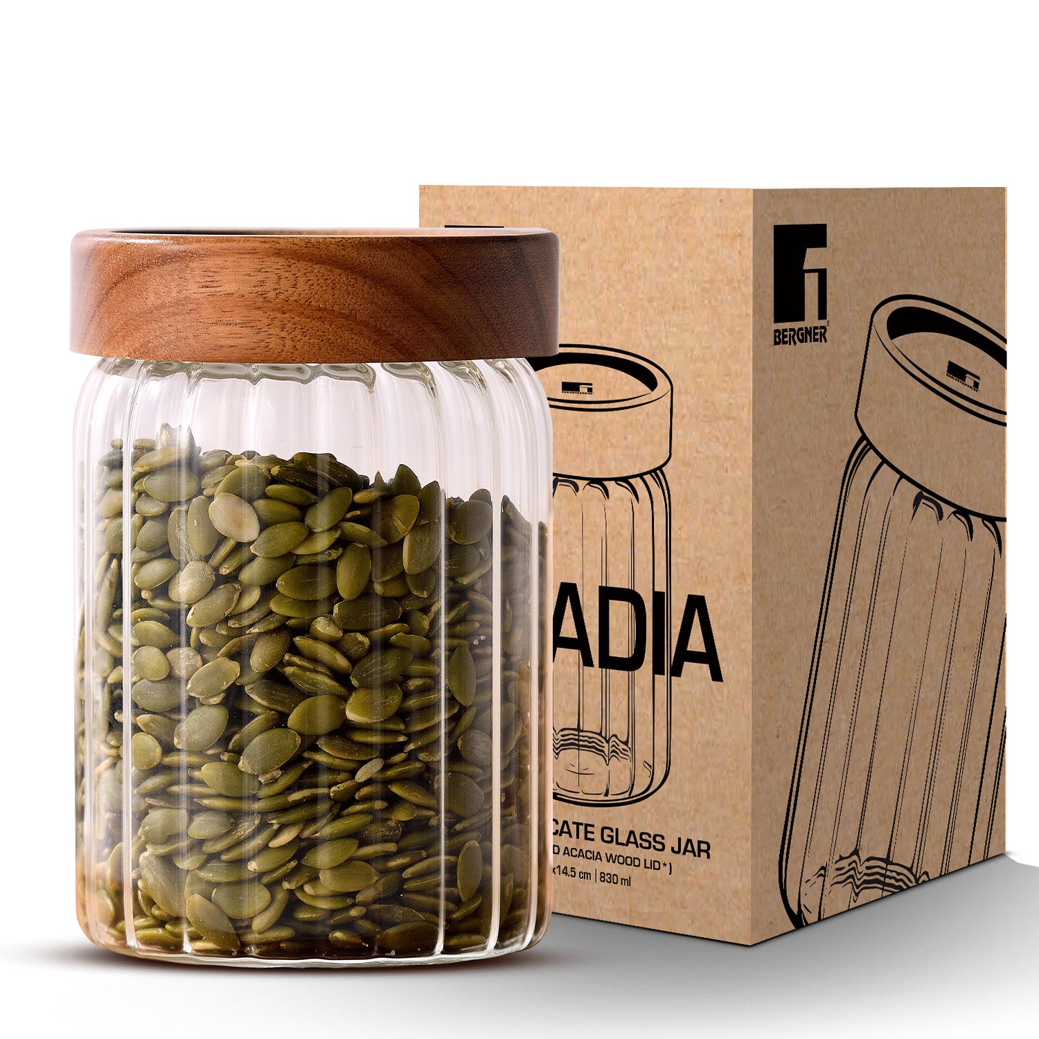 Bergner Acadia 900ml stripe borosilicate glass jar with solid acacia wood lid filled with pumpkin seeds beside its retail packaging box