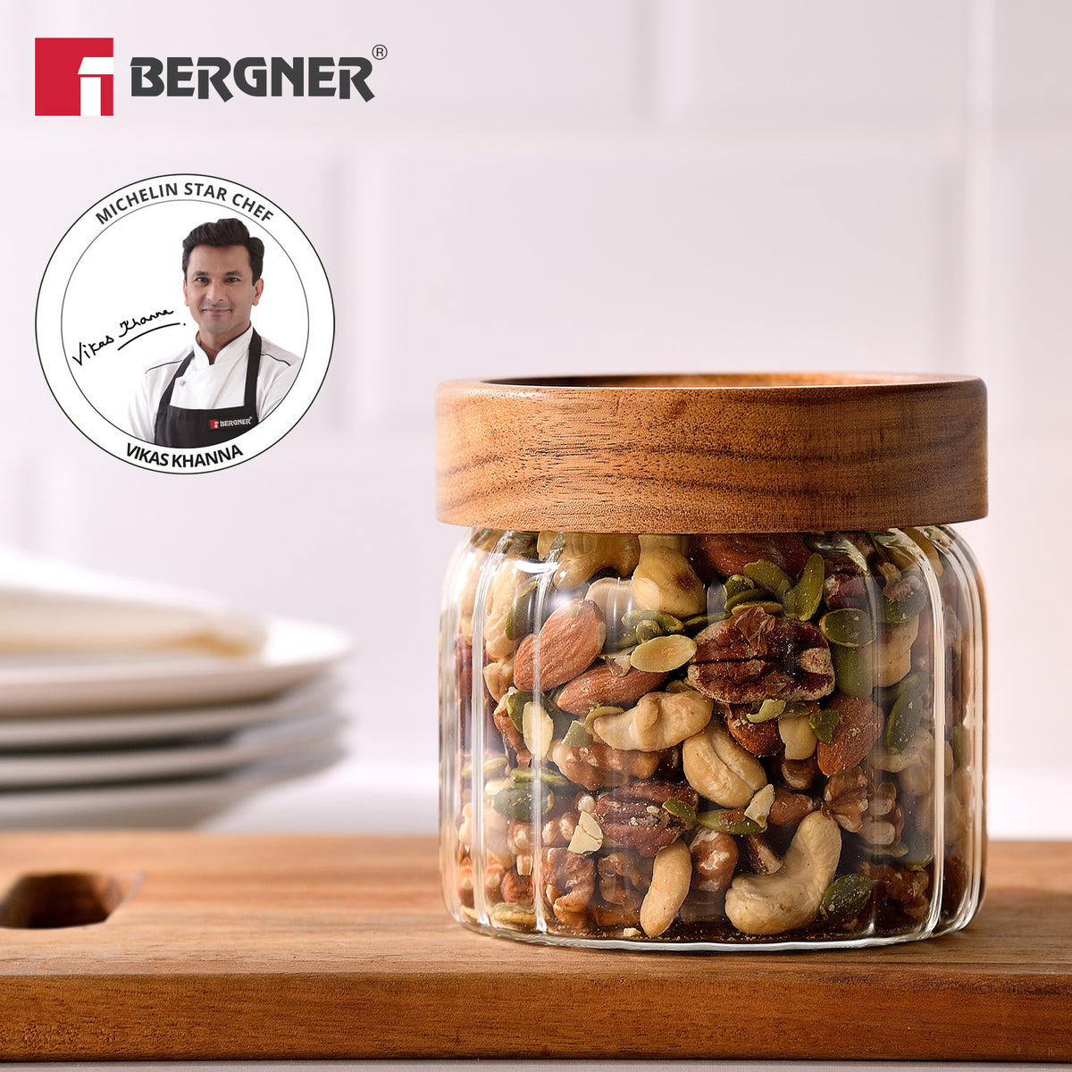 Bergner Acadia 580ml stripe borosilicate glass jar with acacia wood lid storing roasted dried fruits, endorsed by Michelin Star Chef Vikas Khanna