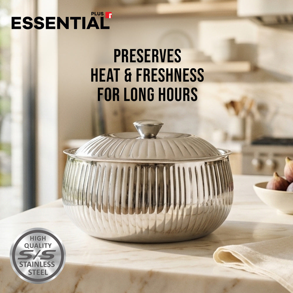 A stainless steel lidded bowl with a ribbed exterior sits on a marble countertop in a softly blurred kitchen setting. Text on the image reads 'ESSENTIAL' and 'PRESERVES HEAT & FRESHNESS FOR LONG HOURS,' with a 'High Quality S/S Stainless Steel' badge in the lower left.
