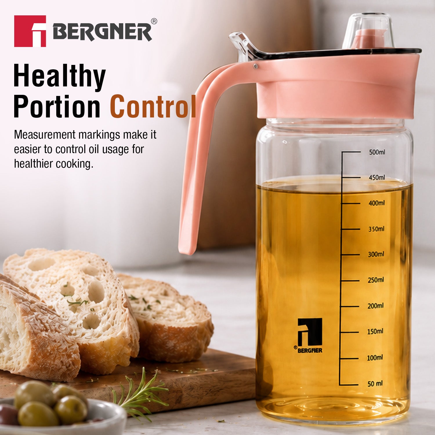 Bergner Acadia 590ml glass oil dispenser bottle with scale markings for healthy portion control, filled with cooking oil next to bread and olives