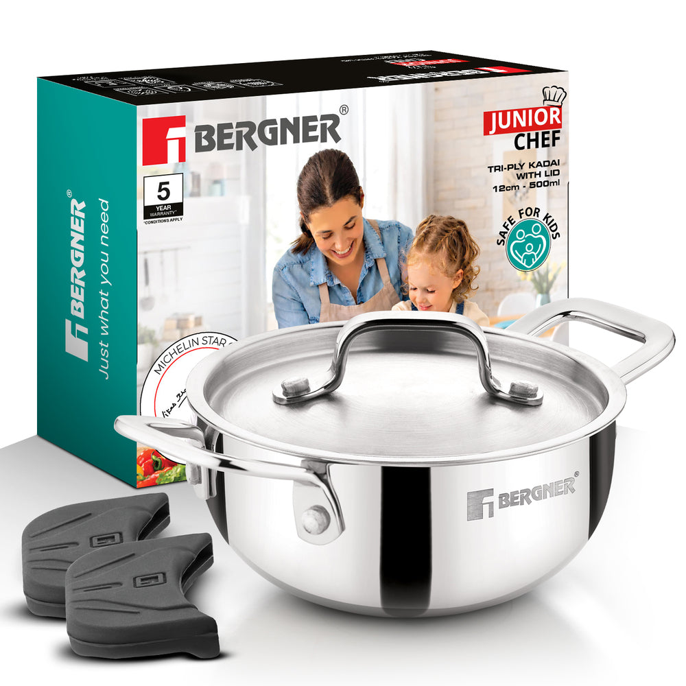 Bergner Junior Chef tri-ply kadhai pot with lid, shown in front of its retail box, with three black silicone trivet liners on a white background.