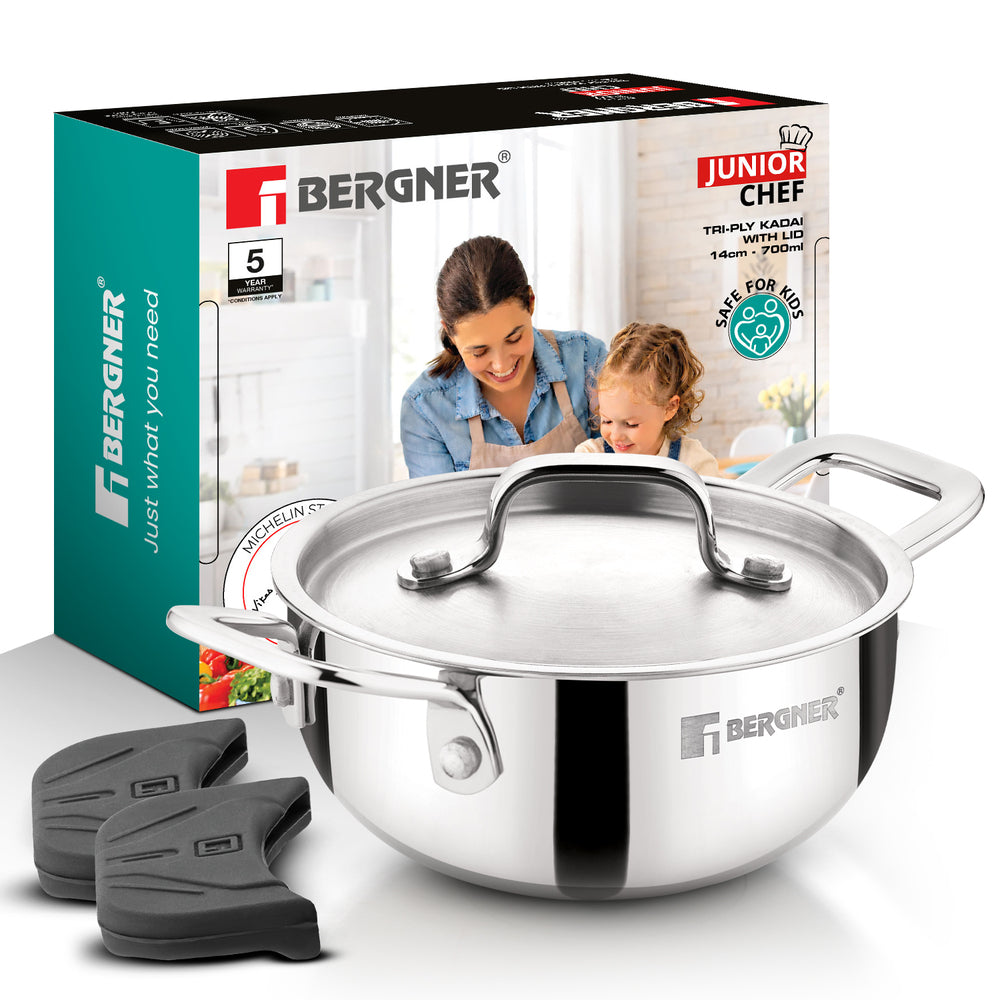 Bergner Junior Chef stainless steel saucepan with lid, shown with its retail box and two black silicone trivet pads on a clean white background.